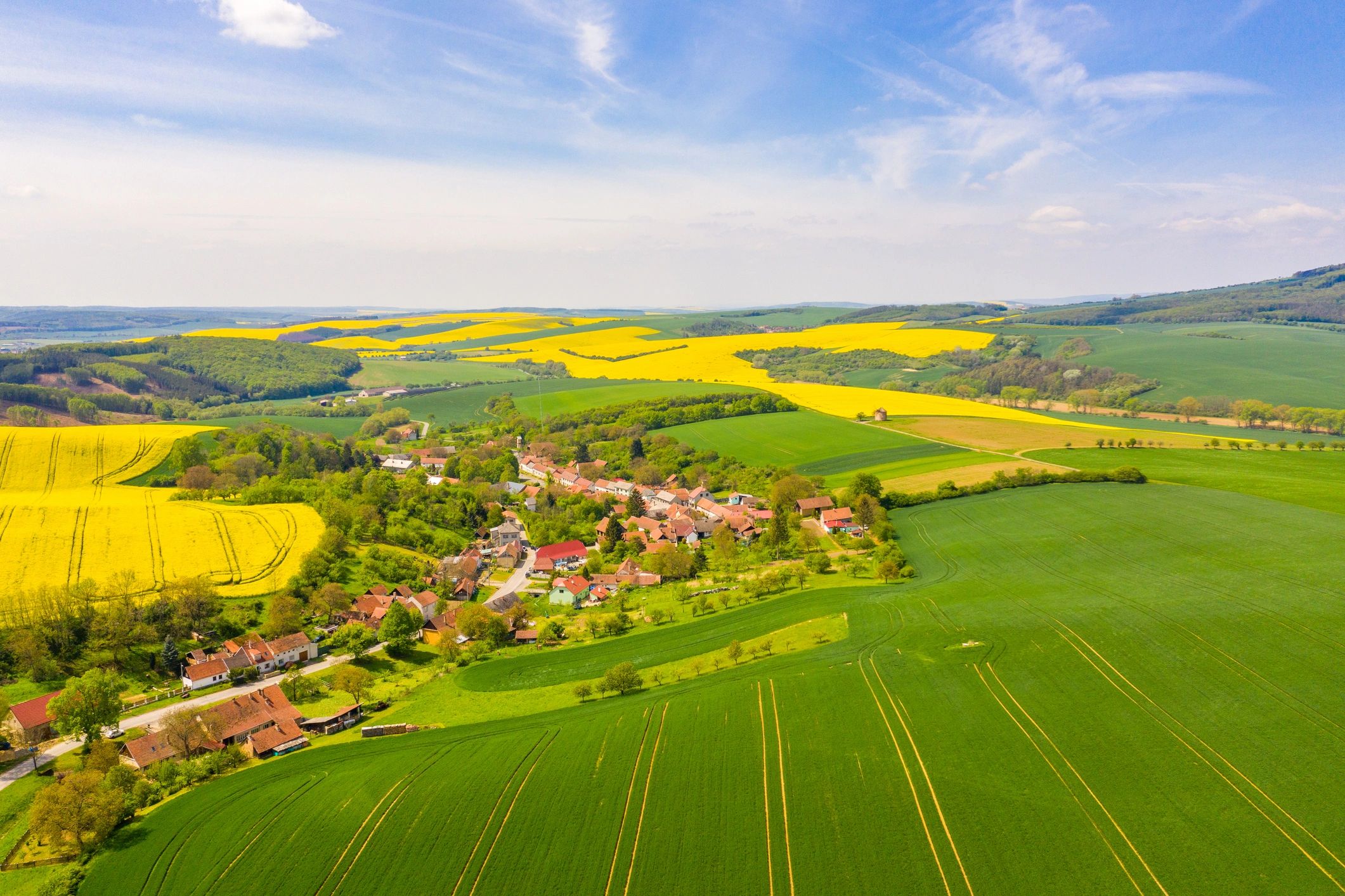 Drone view over rural fields and a small town