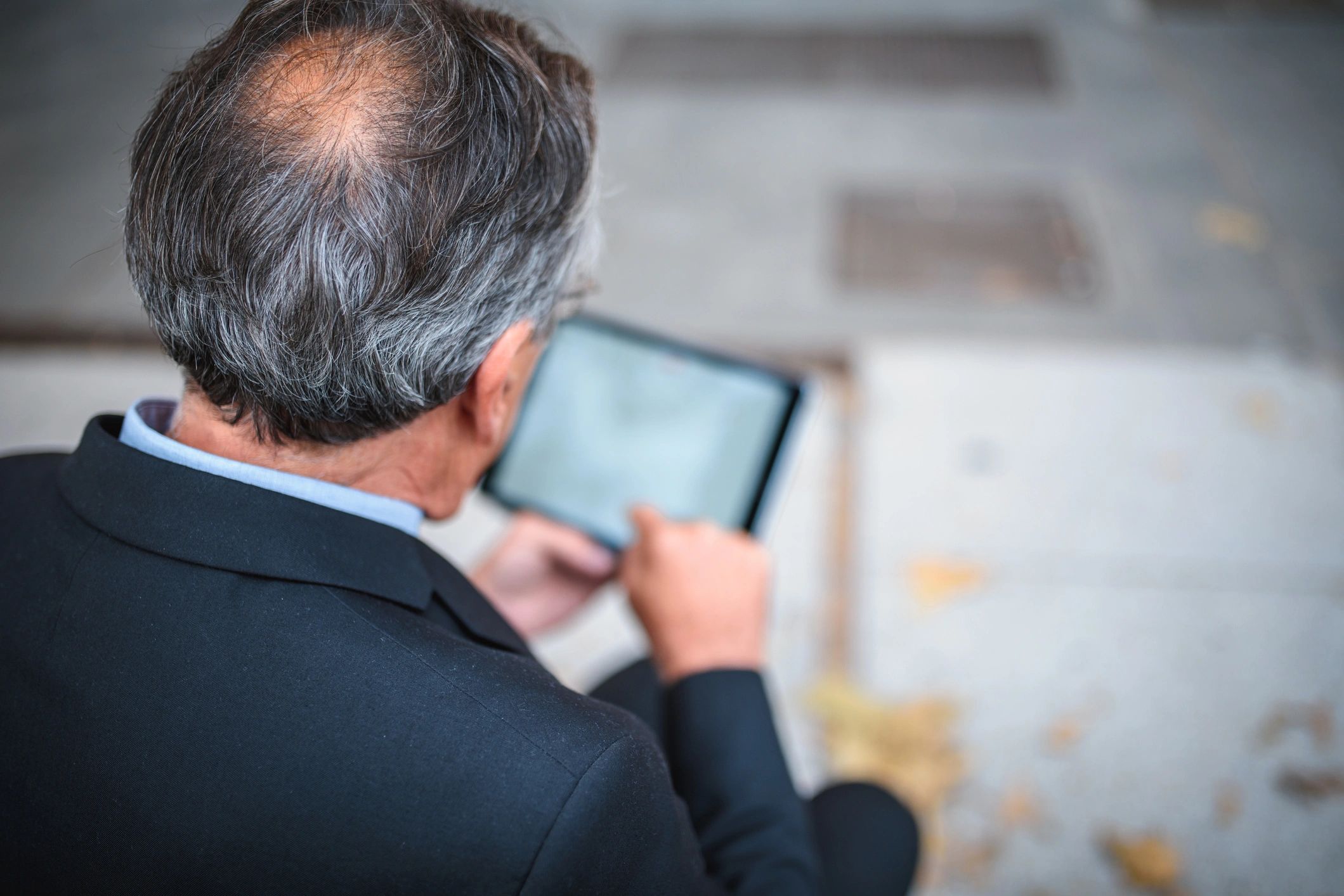 Project manager reviewing data on a tablet