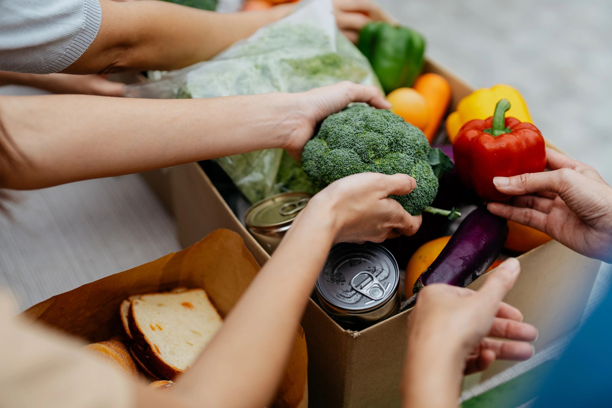 Volunteers packing donated goods at a food bank