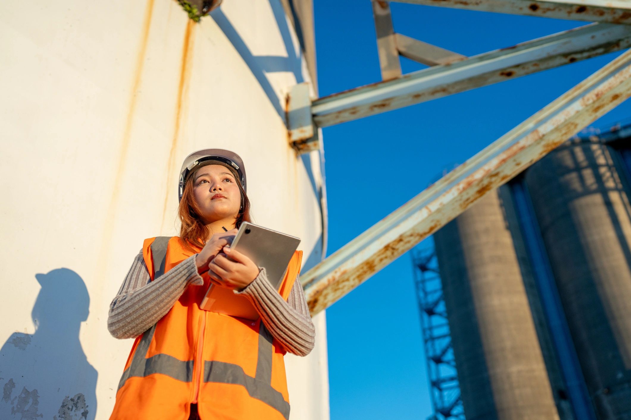 Industrial worker in safety gear at an energy facility