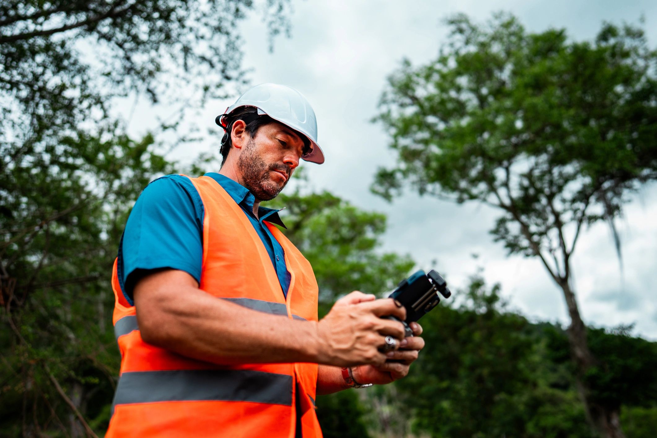 Drone operator at a work site capturing aerial data