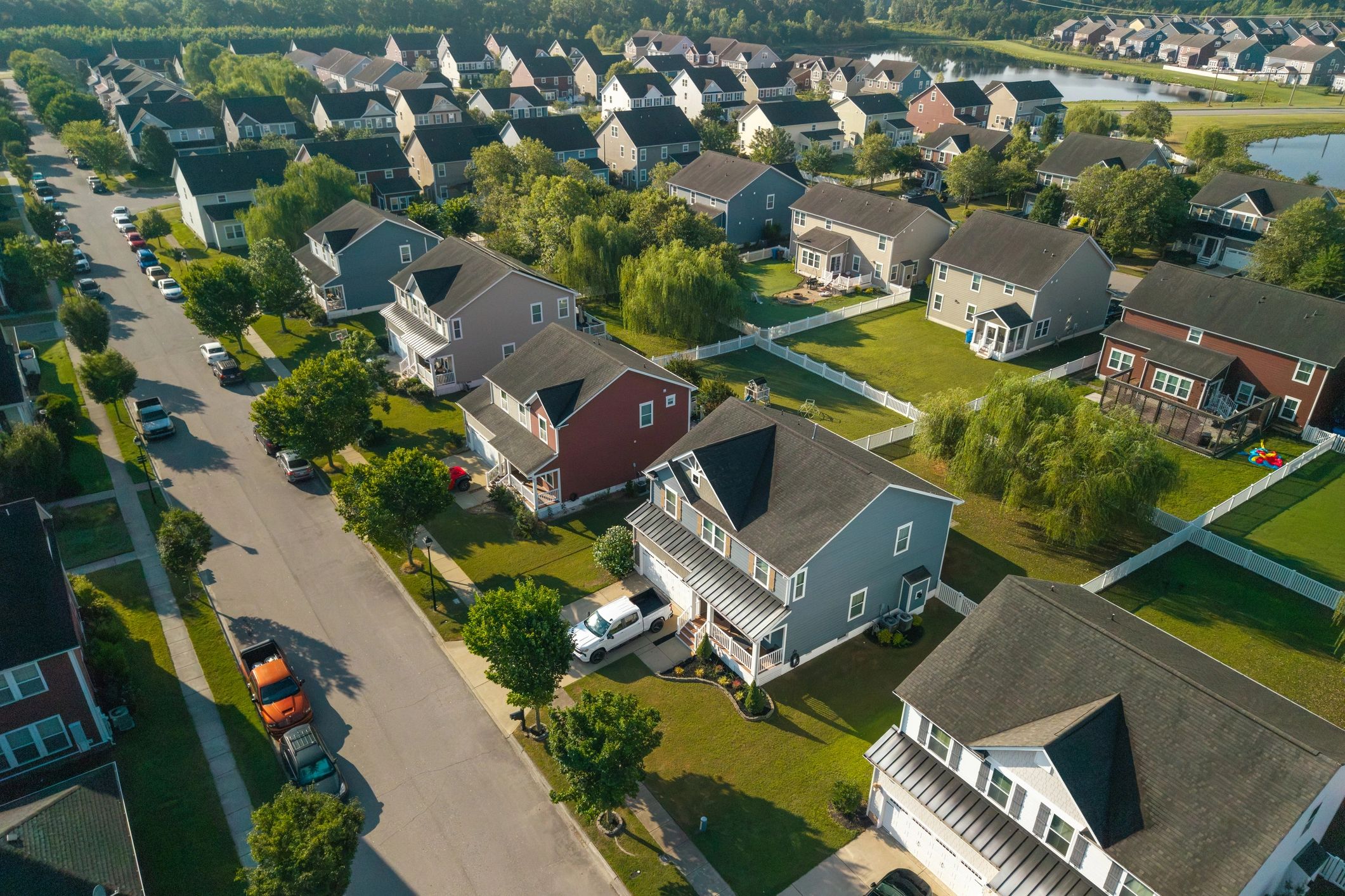 High-angle aerial view of neighborhood roofs showing overall roof condition context