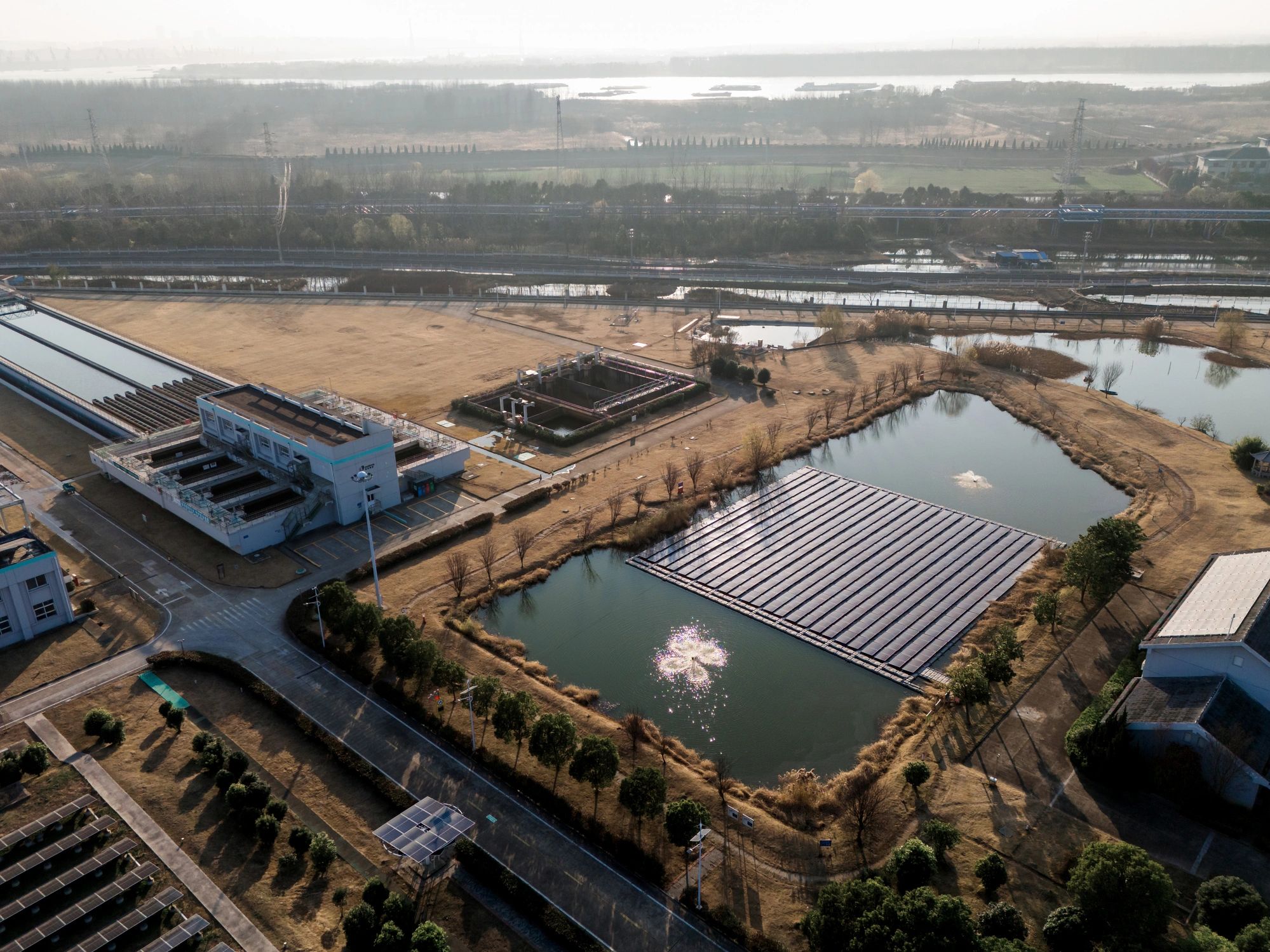 Aerial view of solar panels on a grassy field